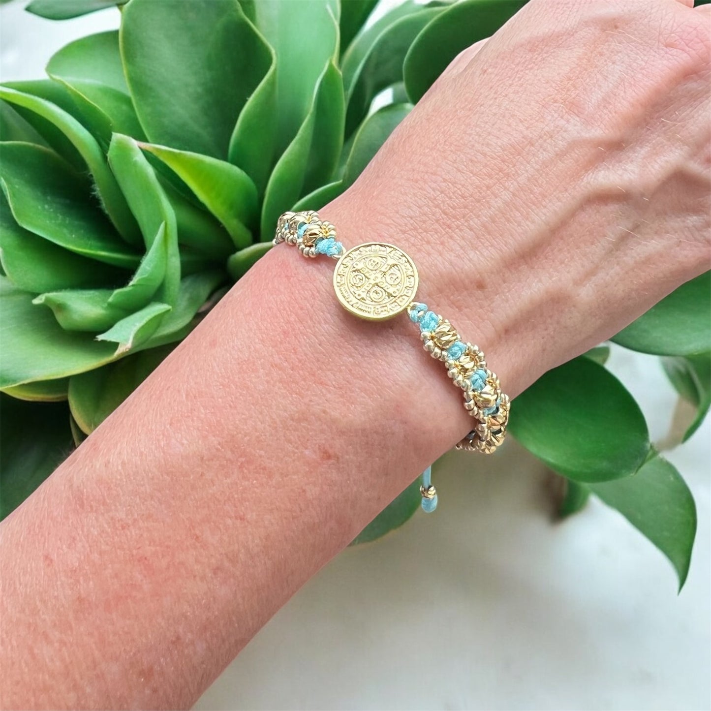 San Benito light blue thread bracelet with golden spheres