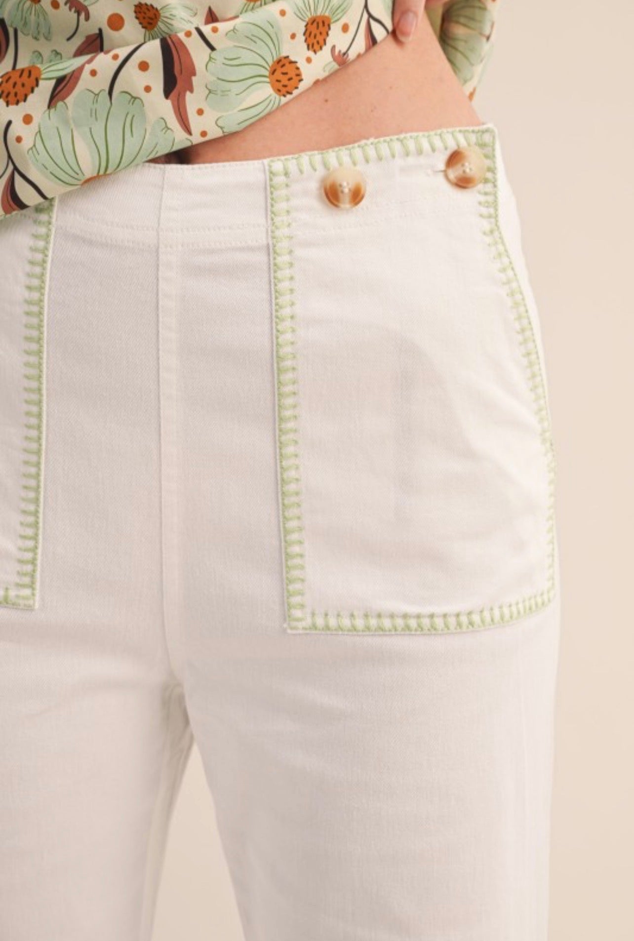 White pants with green seams